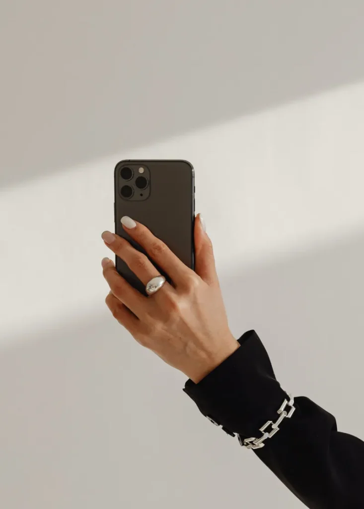 Lady holding Phone Showing Social Media templates