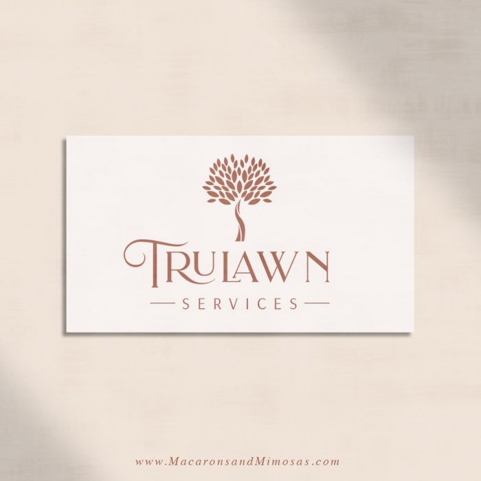 Lawn care service logo design with tree icon and graphic